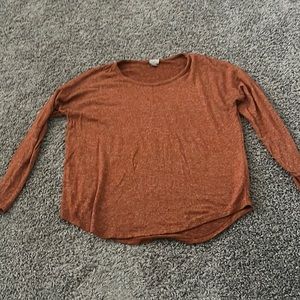 Long sleeved, medium orange shirt made out of cotton very soft